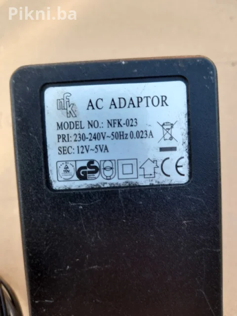 AC/AC ADAPTER 12V ~ 5VA (model NFK-023) prtevarač ispravljač punjač 5