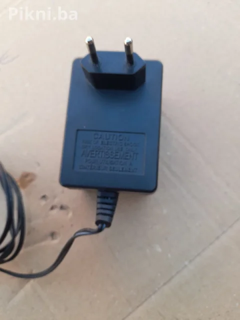 AC/AC ADAPTER 12V ~ 5VA (model NFK-023) prtevarač ispravljač punjač